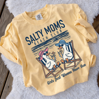 Butter yellow Comfort Colors top with salty moms beach club ducks lounging graphic on white rug flatlay