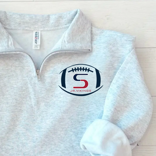 Ash grey Jerzees quarter-zip pullover with seaman jr. vikings team football graphic on left chest, flat lay
