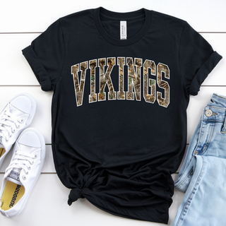 Black Bella Canvas tee with arched VIKINGS camo print in woodland camo with white outline

