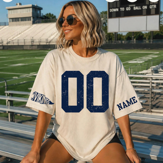 Sand tee with navy distressed '00' number on front, 'VIKINGS' pennant flag icon and 'NAME' text on sleeves, custom number jersey top for Seaman Vikings