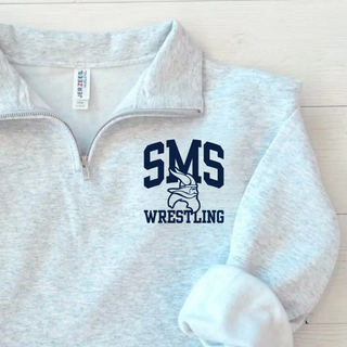 Close-up of the Seaman Vikings Middle School arched SMS, Viking head, and Wrestling design on an Ash Grey Cadet Quarter-Zip.