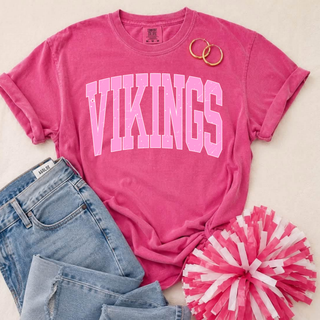 Seaman Vikings Pink Out distressed arch top in hot pink Comfort Colors flatlay with jeans, hoop earrings, and pink pom-pom