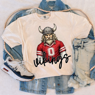 Cream tee with viking mascot in red jersey, Seaman Vikings Topeka Kansas spirit wear
