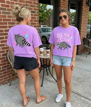 Violet Comfort Colors tee with See Ya Soon raccoon and colorful stars front and back view
