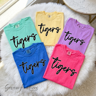 Folded tigers script tops in island reef, butter, neon violet, crunchberry, and flo blue pastel colors
