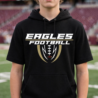 Teen wearing black Silver Lake Eagles Football Apex fleece short sleeve hooded pullover at football field