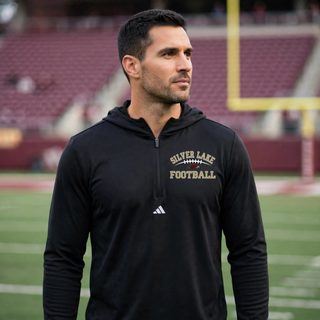 Man wearing black Silver Lake Eagles Football Classic Adidas quarter-zip hooded pullover on football field