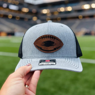 Close up of Silver Lake Eagles Football leather patch trucker hat design
