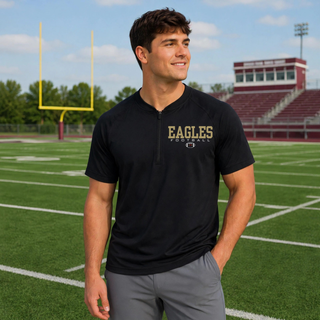 Model wearing the Silver Lake Eagles Football Standard Repeat 1/2 Zip Short Sleeve Jacket in Black
