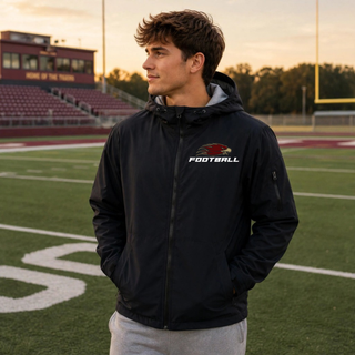 Man wearing black Silver Lake Eagles Football Strike waterproof insulated jacket on football field

