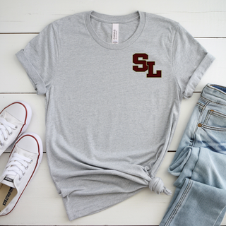 Athletic heather tee with staggered SL block letter logo on left chest styled with jeans and sneakers
