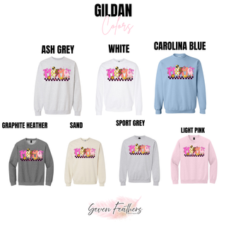 Gildan crewneck sweatshirt color chart showing softball mama checkered graphic top in ash grey, white, carolina blue, graphite heather, sand, sport grey, and light pink
