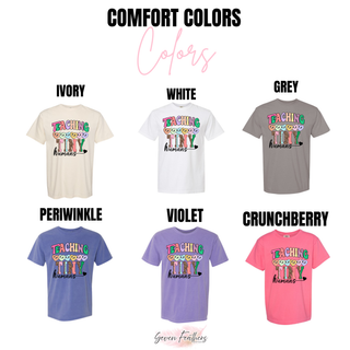 Comfort Colors teaching tiny humans tee in ivory, white, grey, periwinkle, violet, and crunchberry
