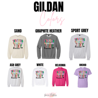 Gildan teaching tiny humans top in sand, graphite heather, sport grey, ash grey, white, heliconia, and orchid
