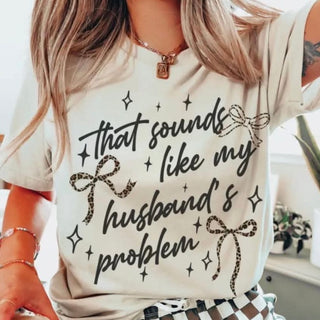 That Sounds Like My Husband's Problem Graphic Top in ivory with leopard bow graphic styled with checkered pants
