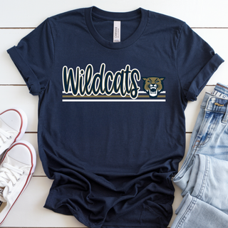 Navy Wildcats t-shirt flat lay with gold and navy 'Wildcats' script logo and a snarling wildcat mascot head above two stripes, styled with white sneakers and folded denim jeans