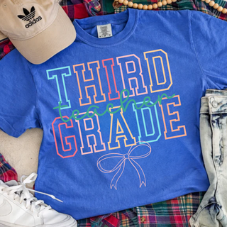Flo Blue adult Third Grade Teacher Bow Comfort Colors graphic tee with colorful varsity outline letters