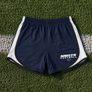 Navy and white Topeka Saints Full Speed Football women’s Cadence Performance Shorts displayed on a football field