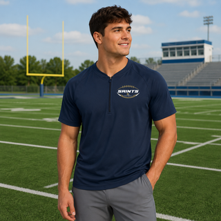 True navy Topeka Saints gridiron crest half-zip short sleeve jacket modeled on a football field