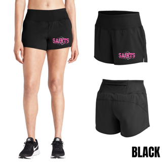 Woman wearing black Topeka Saints Volleyball Distressed Swirl Women's Repeat Short with sneakers