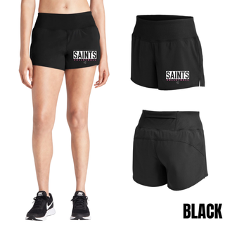 Woman wearing black Topeka Saints Volleyball letter block women's repeat short with white block lettering