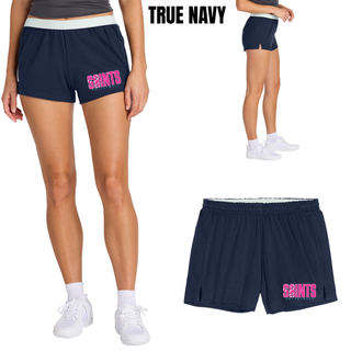 Woman wearing navy Jersey Knit Squad Short with pink Saints Volleyball logo and white waistband