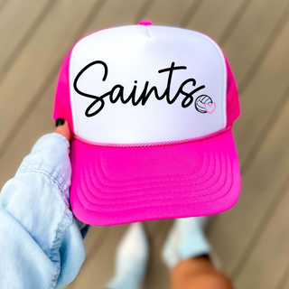 Hand holding Topeka Saints Volleyball Trucker Hat in white and neon pink with script logo and heart volleyball icon