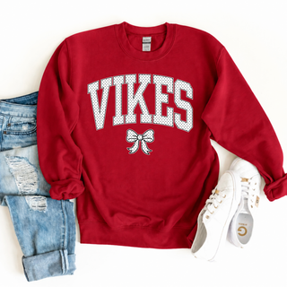 Topeka Seaman Vikes polka dot bow graphic on a cardinal red Gildan crewneck sweatshirt