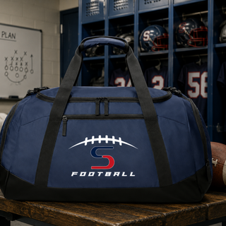 Topeka Seaman Vikings football S logo duffel bag in navy in football locker room with helmets and jerseys
