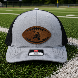 Topeka Seaman Vikings trucker hat with football shaped leather patch engraved with viking mascot on heather grey and black Richardson 112 snapback

