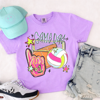 Violet tee laid flat with Game Day graffiti script, volleyball net, foam finger number one, and star accents graphic
