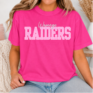 Hot pink Wamego Raiders top with Wamego in white cursive script above RAIDERS in pink polka dot block lettering