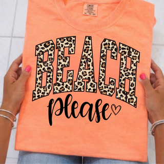 Neon cantaloupe Comfort Colors tee held up showing beach please leopard varsity graphic with heart
