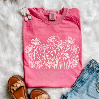 Comfort Colors crunchberry short sleeve graphic tee folded flat with white wildflower bouquet graphic styled with jeans and brown sandals